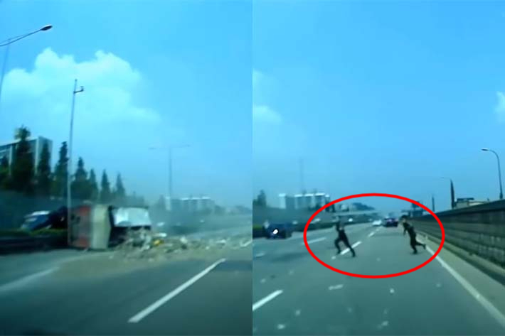 차량 전복 사고 현장을 목격하고 현장으로 뛰어가는 두 군인들. 유튜브 채널 '한문철 TV' 캡처