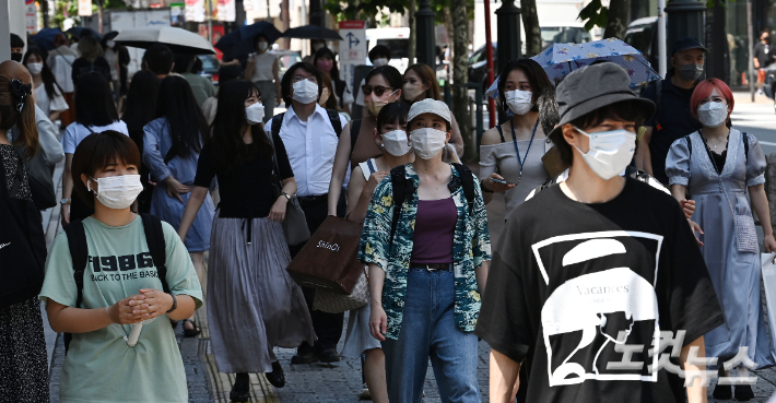 시부야역 인근 거리를 지나는 도쿄 시민들. 올림픽사진공동취재단