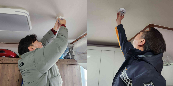 이춘호 춘천 자유빵집 대표(왼쪽)와 용석진 춘천소방서장(오른쪽)이 화재취약계층에 주택안전물품을 설치하는 모습. 춘천소방서 제공